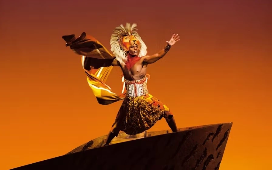 Simba and Nala lock eyes in the jungle. The Lion King at the Lyceum Theatre in London's West End